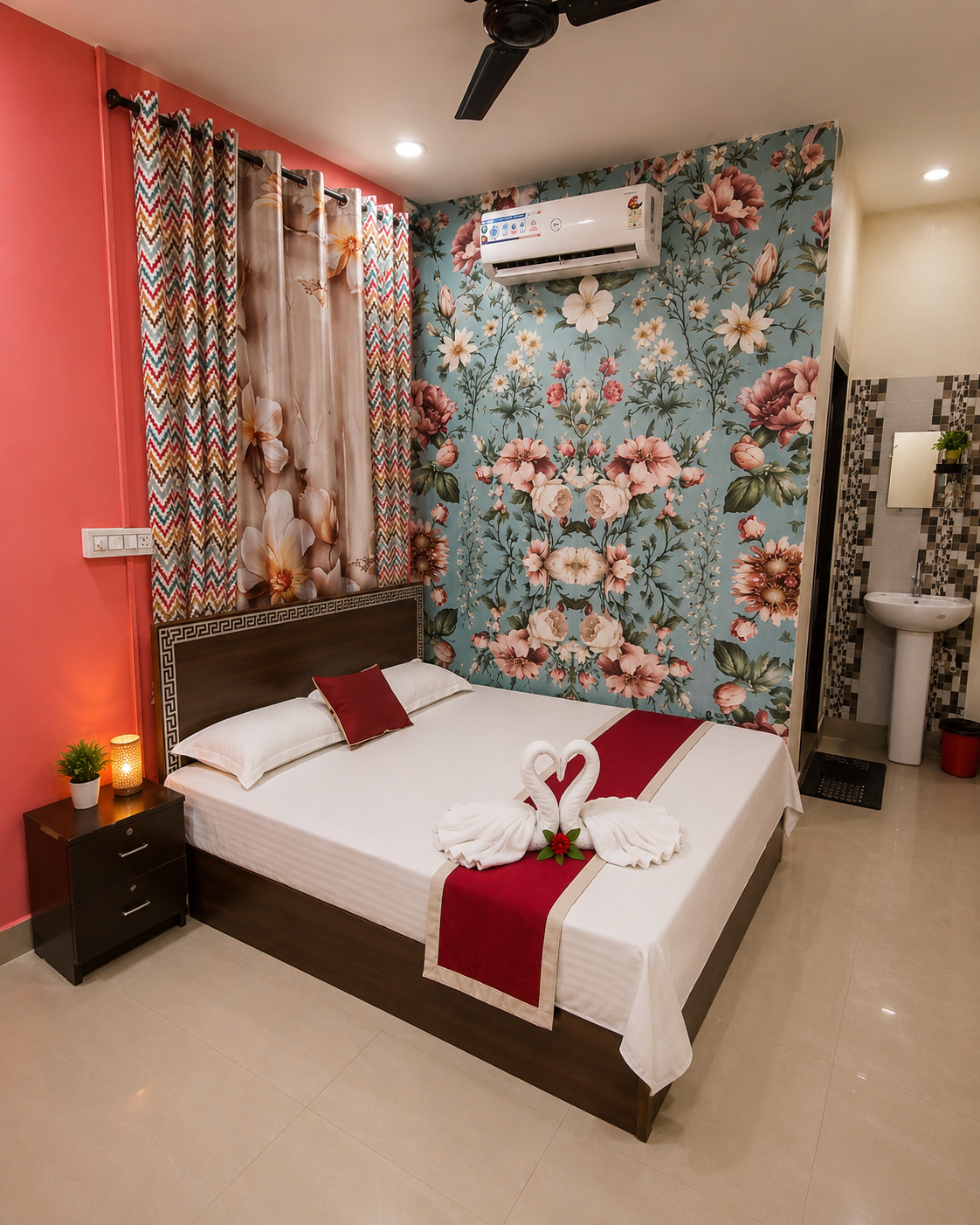 Comfort Room with floral feature wall at Decent Lodge Kamareddy